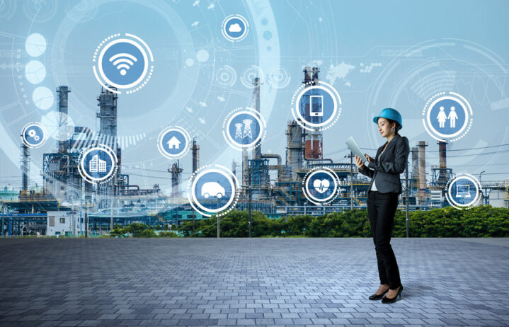Young engineer and smart factory concept. internet of things. sensor network.
